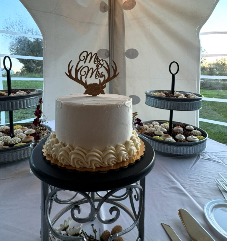 Farmers feed bunk wedding cake with antlers